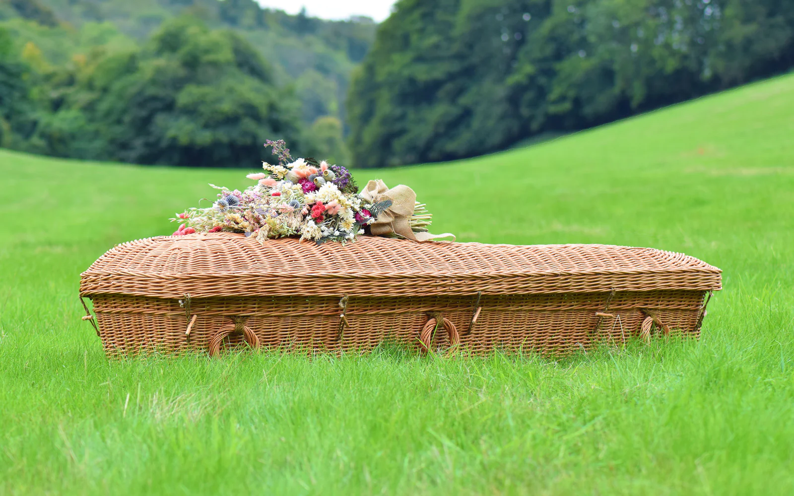 This is an eco-friendly brown woven bamboo casket